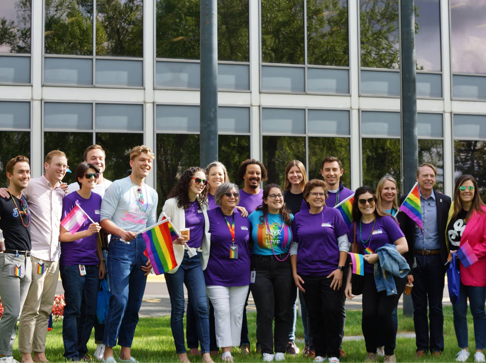 Employees at Pride Flag raising ceremony